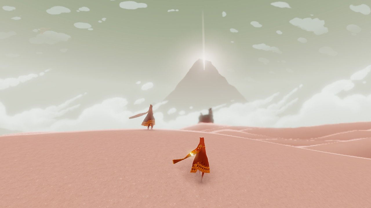 Journey interview austin wintory orchestral concert performances - an image of two characters in red cloaks and scarves standing on a cast desert dune with the shadow of a great mountain in the distance.