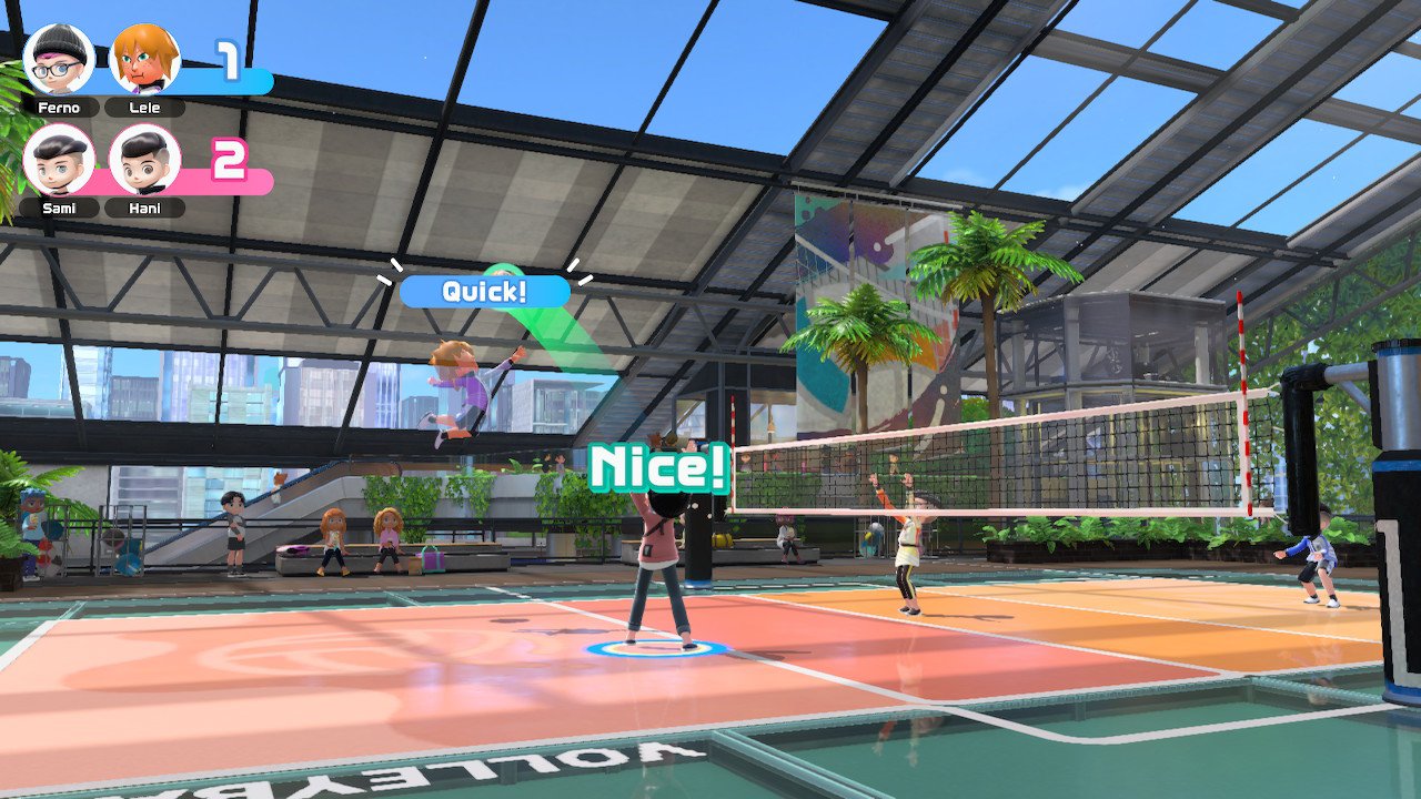Nintendo Switch sports secret techniques quick spike volleyball - one character sets the ball up for a mid-jump teammate ready to spike the ball